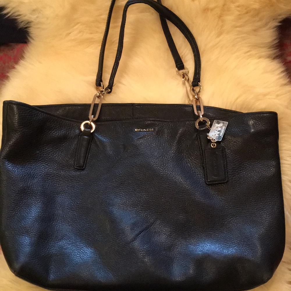 Women’s black leather coach purse